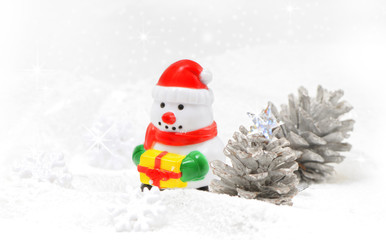 Snowman on snow with snowflake background