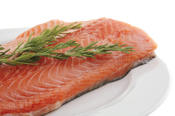 raw salmon fillet on white and rosemary