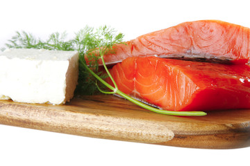 fresh smoked salmon on white plate with white cheese