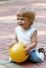 The little boy with a ball in hands