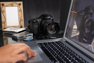 Photographer using laptop