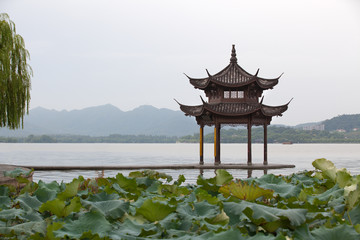 Famous West Lake in Hangzhou, China. Beautiful scene at sunrise.