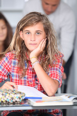 Fototapeta premium Closeup of student girl in classroom