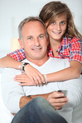 Closeup of father and daughter at home