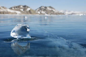 Piece of ice on the frozen lake