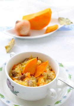 Pumpkin risotto decorated with pieces of a baked pumpkin