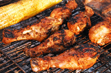 Obraz na płótnie Canvas chicken legs on grill