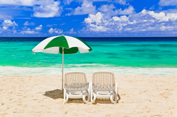 Chairs and umbrella at tropical beach