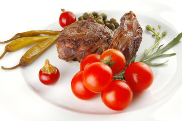 grilled meat medallion served on white