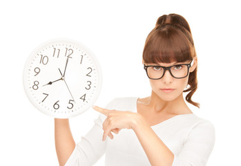 woman holding big clock