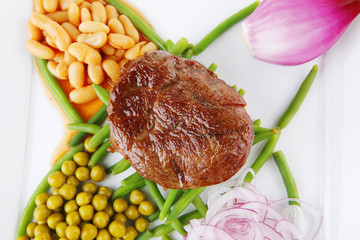 meat medalion on beans