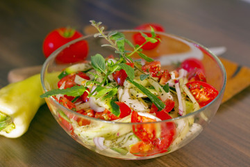 Salad in glass dish in the kitchen