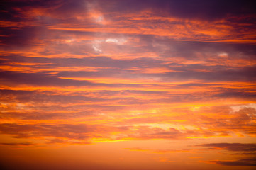 Naklejka na ściany i meble Golden sunset clouds background