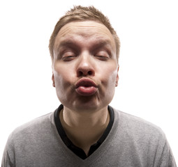 Funny man trying to give a kiss. Isolated on white.