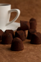 cup of coffee with cinnamon on a old paper background.