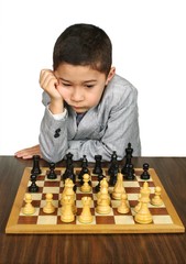 Boy contemplating a chess move