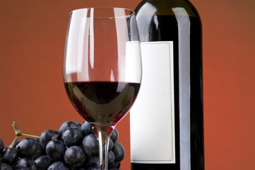 Red wine with grapes