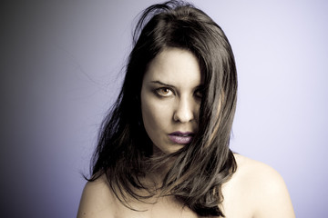 Fototapeta premium Voluptuous look of brunette young woman. intense expression. inn