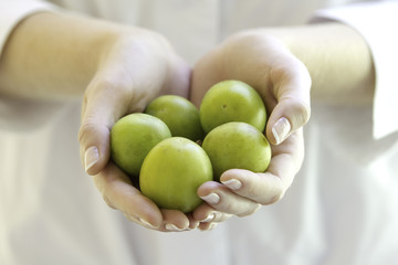 Fresh fruits in woman's hands