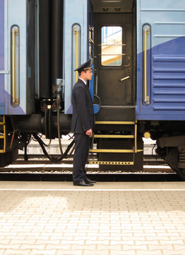 Conductor to stand beside entry in train