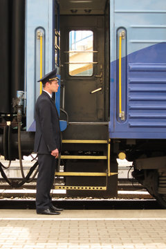 Conductor to stand beside entry in train