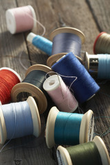 assortment of colorful cotton reels on table