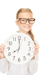 girl holding big clock