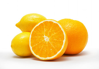 Fresh oranges and lemons isolated on white