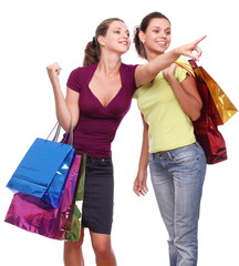Two girlfriends with shopping bags.