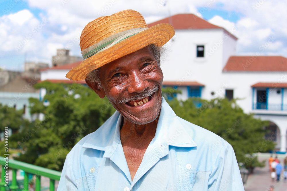 Wall mural Old sympathetic cuban man with straw hat ,  Cuba