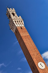Siena city hall clock tower closeup view.
