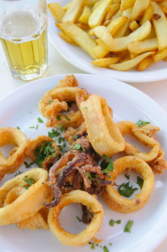 Fried fish at lunch with cheaps and beer