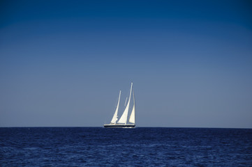 Fototapeta premium Yacht sailing in the blue ocean