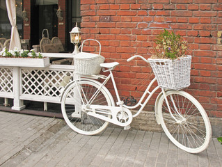 Detail design summer cafe with a bicycle, painted white