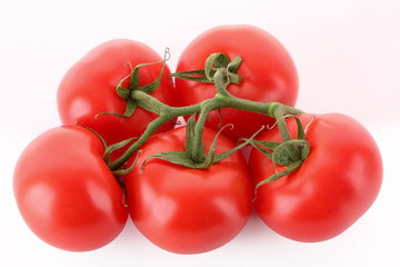Few tomatoes isolated on white