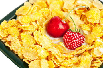 bowl of cornflakes cherry  and strawberry  isolated on white