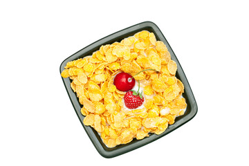 bowl of cornflakes cherry  and strawberry  isolated on white