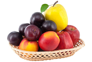 ripe juicy fruit in a wicker vase