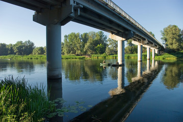 Fishing under the bridge.
