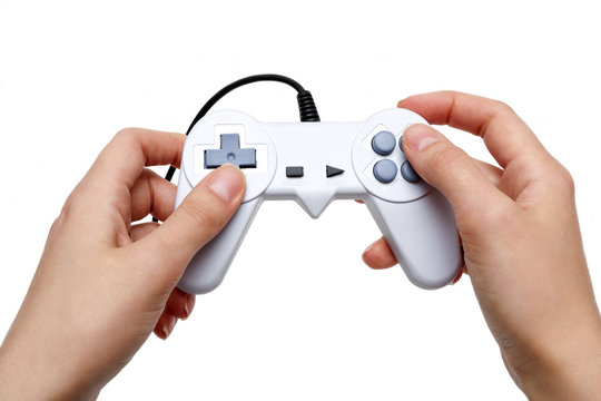 white game controller in hand isolated on white background
