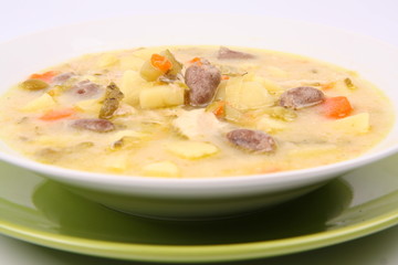 Pickled cucumber soup with some giblets, Polish cuisine