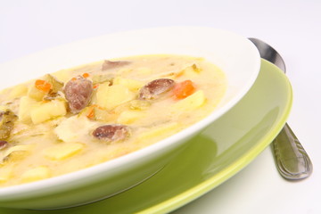 Pickled cucumber soup with some giblets, Polish cuisine