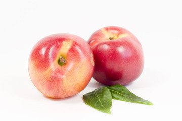 Juicy nectarines on a white background