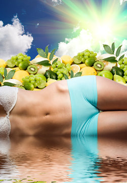 woman body in water over fresh fruits and sunny sky
