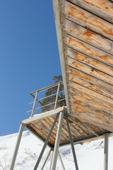 Obraz premium Wooden steps of the stairs against a blue sky