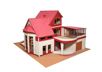 An isolated cottage mock up (scale model) on a white background