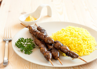Grilled chicken hearts with turmeric rice