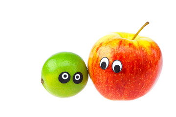 lime and apple with eyes and faces isolated on white