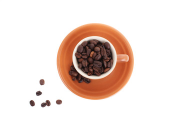 cup and coffee beans isolated over white background