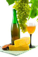 Bottle of wine, glass and grapes